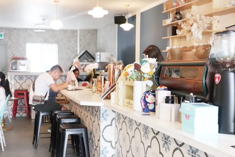 Counter and seating inside Another Land Coffee, North York